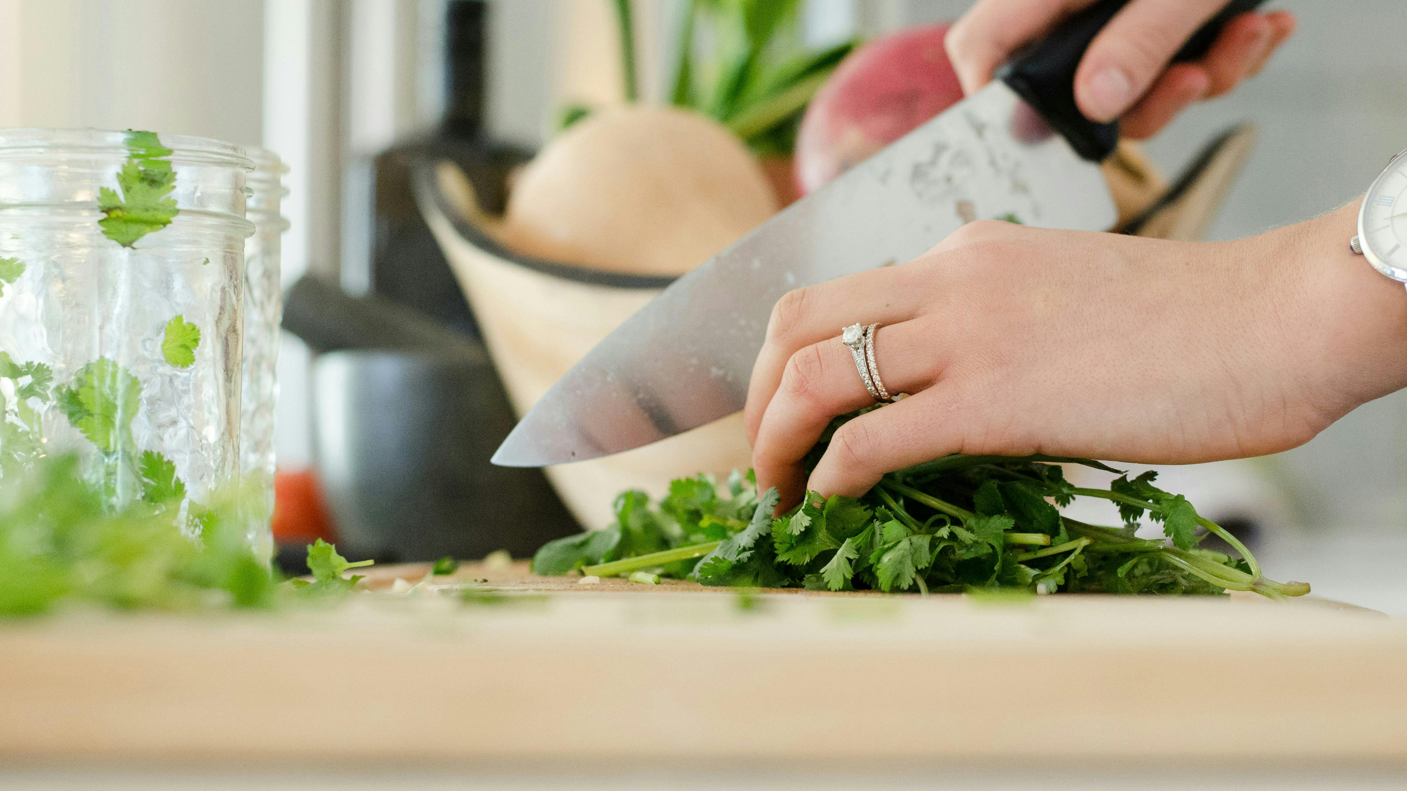 Slicing herbs with a chef's knife.