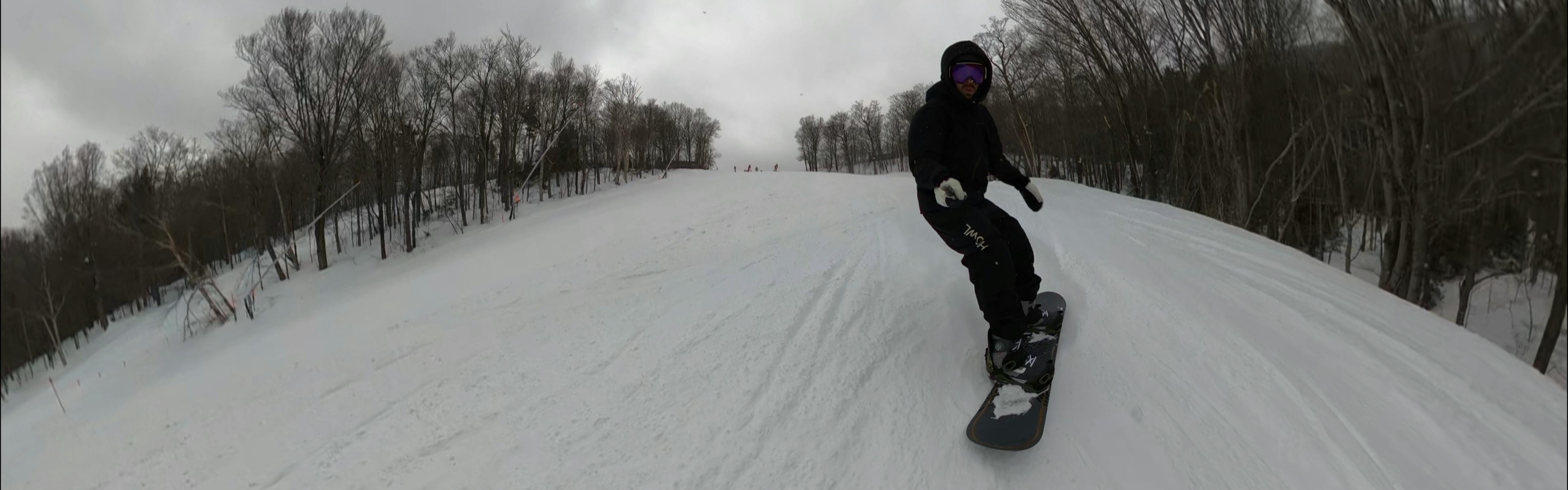 A snowboarder on the 2024 K2 Standard Snowboard. 