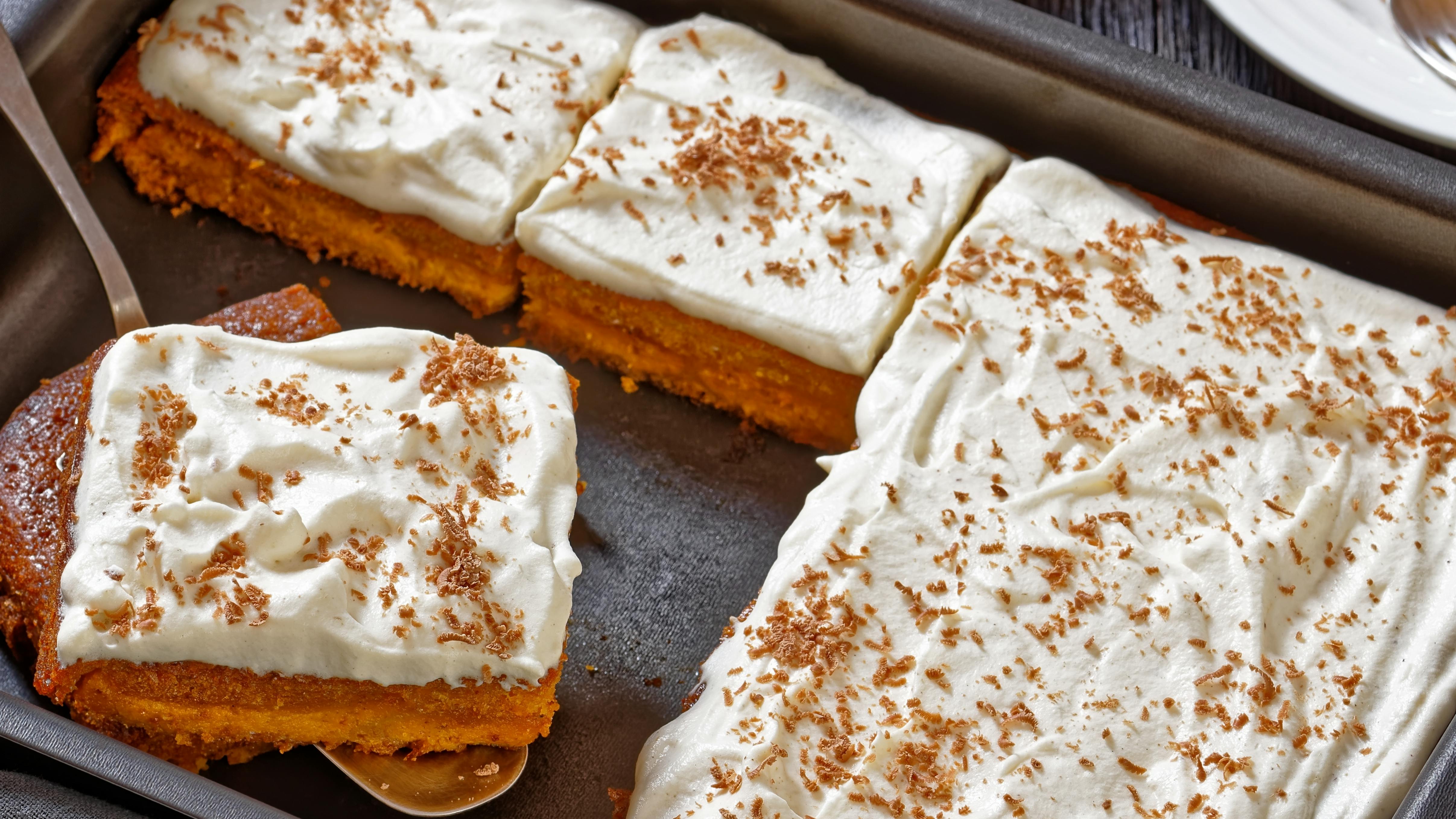 Pumpkin cake with frosting in a pan. 