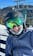 This image shows a female skier wearing the Smith Mission MIPS Helmet with Smith Chromapop goggles.