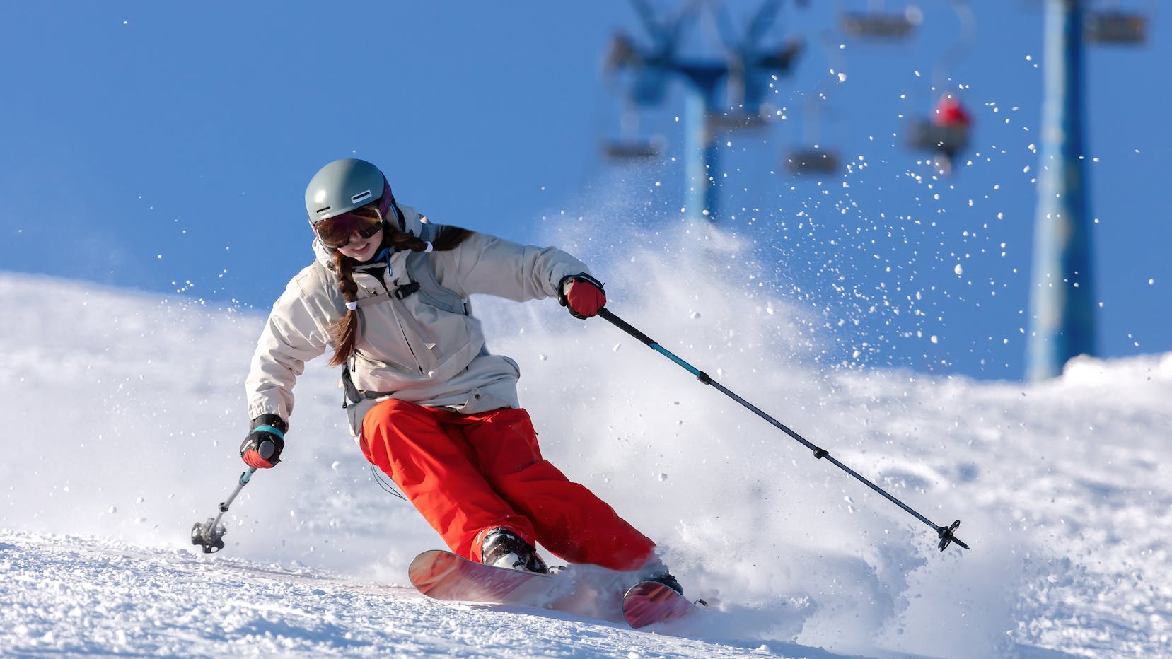 A female skier turns down the mountain. 
