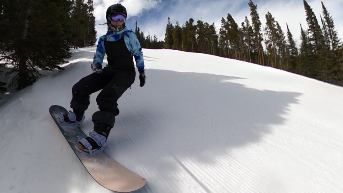 A snowboarder on the Nidecker Elle Snowboard.