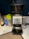 Breville Smart Grinder Pro Coffee & Espresso Grinder on kitchen counter, sugar and syrups in background.
