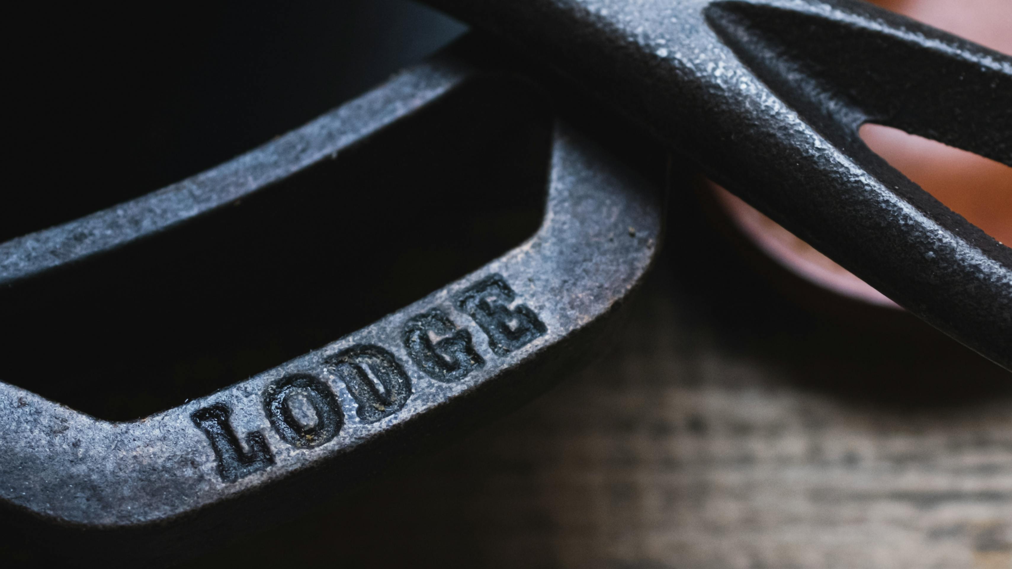 Close up of a Lodge cast iron skillet handle. 