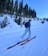 Girl touring uphill on Salomon QST skis