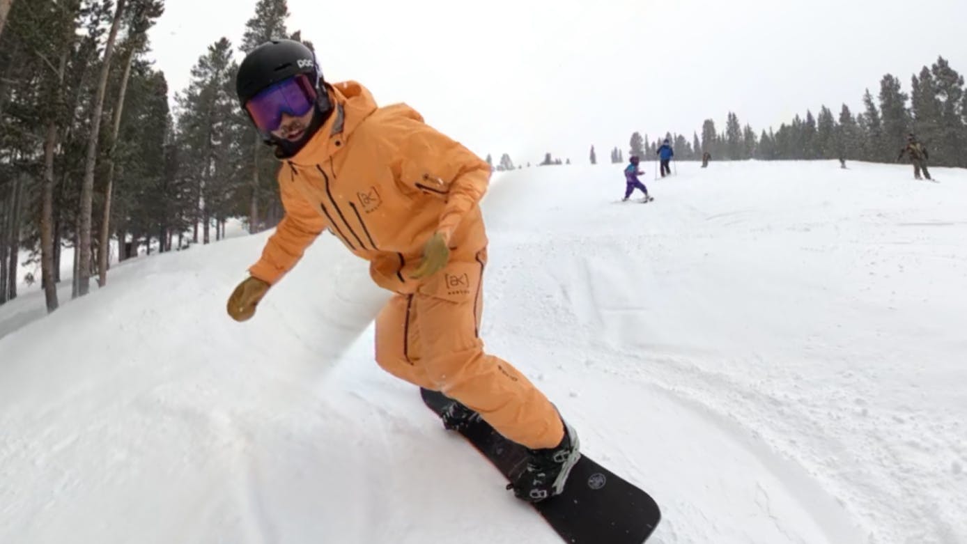 A snowboarder on the Never Summer Easy Rider Snowboard.