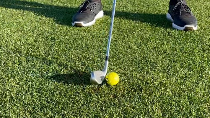A golfer using the TaylorMade Stealth HD Irons. 