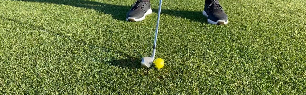 A golfer using the TaylorMade Stealth HD Irons. 