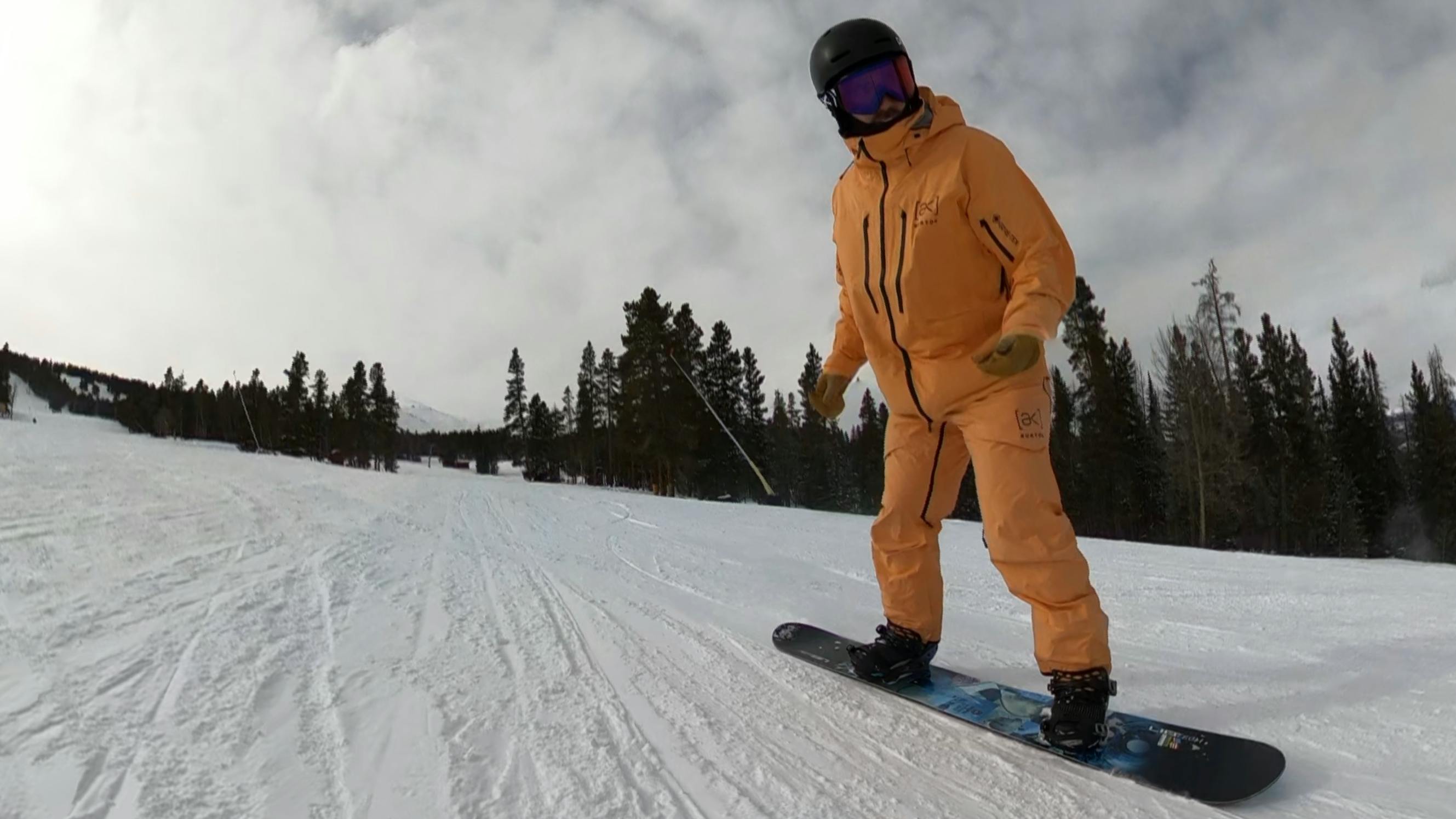 A snowboarder on the Lib Tech Skate Banana Snowboard. 