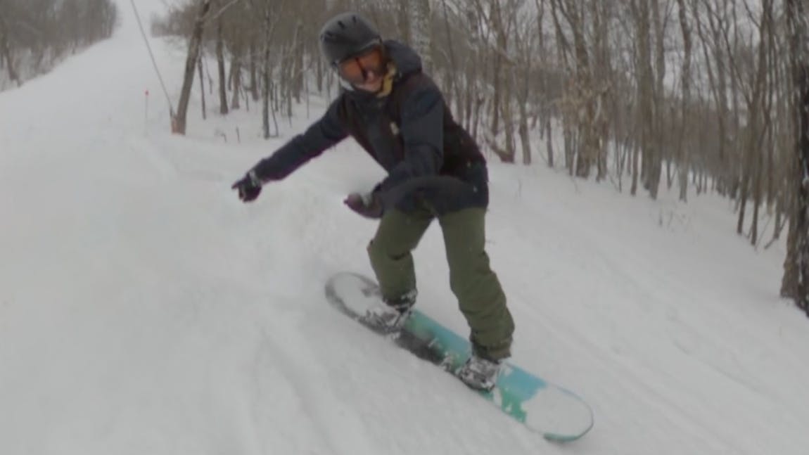 A snowboarder on the 2024 Bataleon ThunderStorm Snowboard.