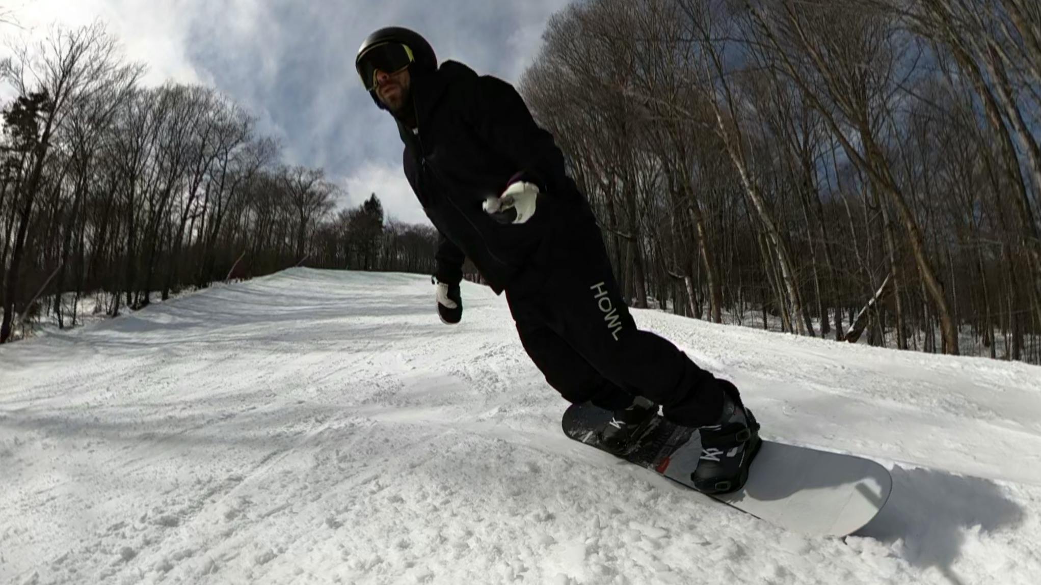 A snowboarder on the Nitro Prime Raw Snowboard.