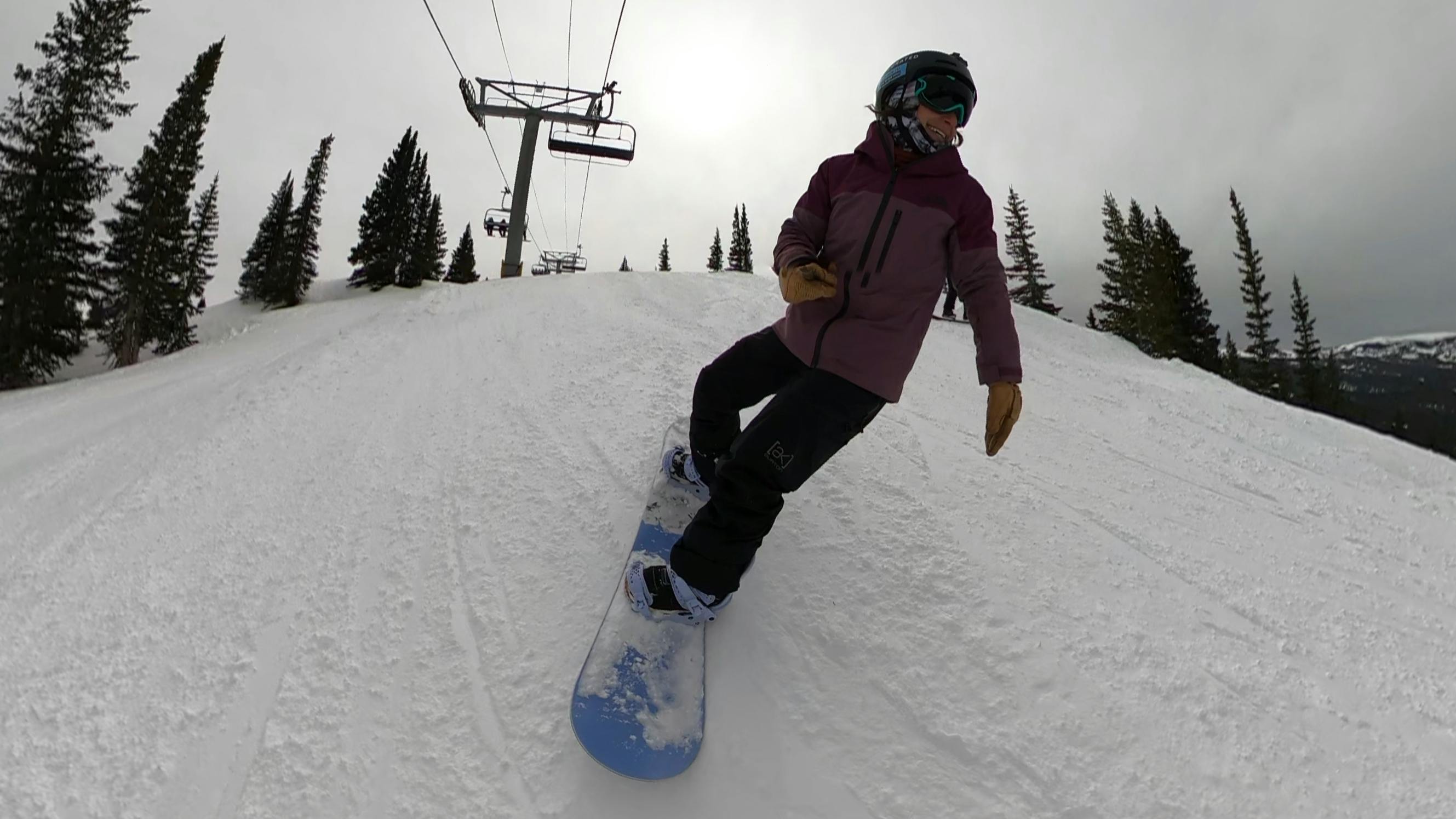 A snowboarder on the Roxy Dawn Snowboard. 