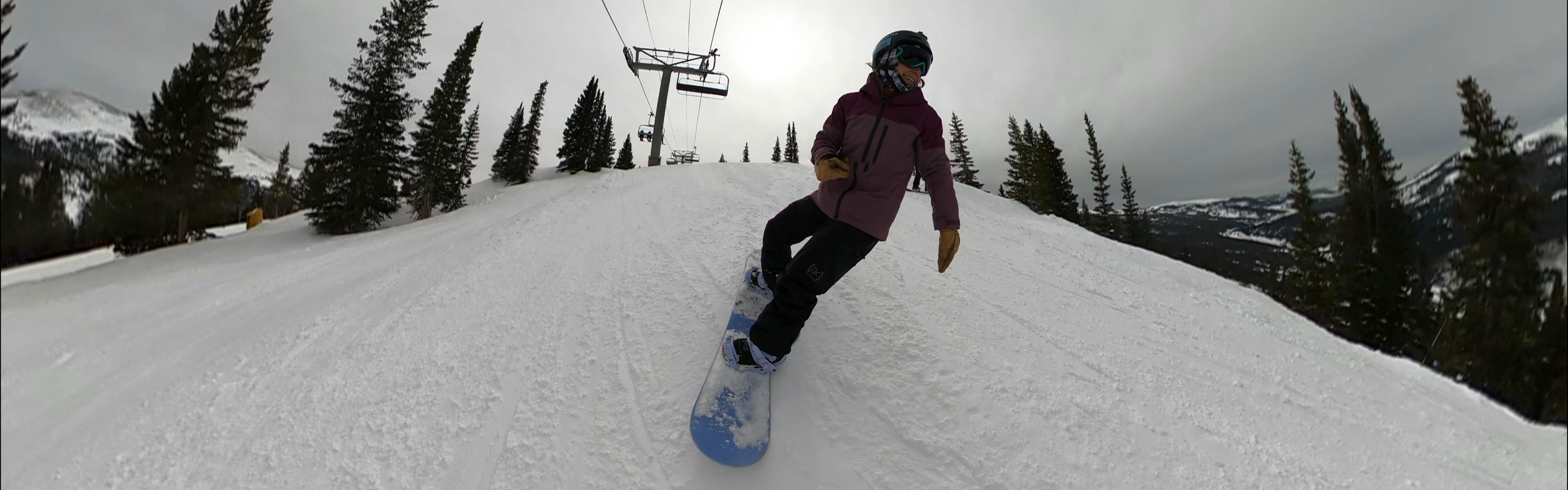 A snowboarder on the Roxy Dawn Snowboard. 