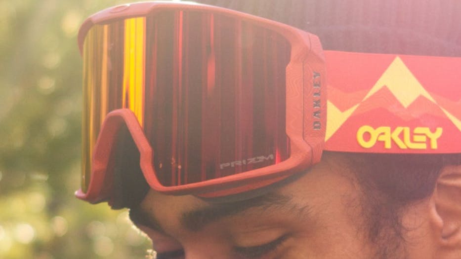 A snowboarder wearing Oakley goggles. 
