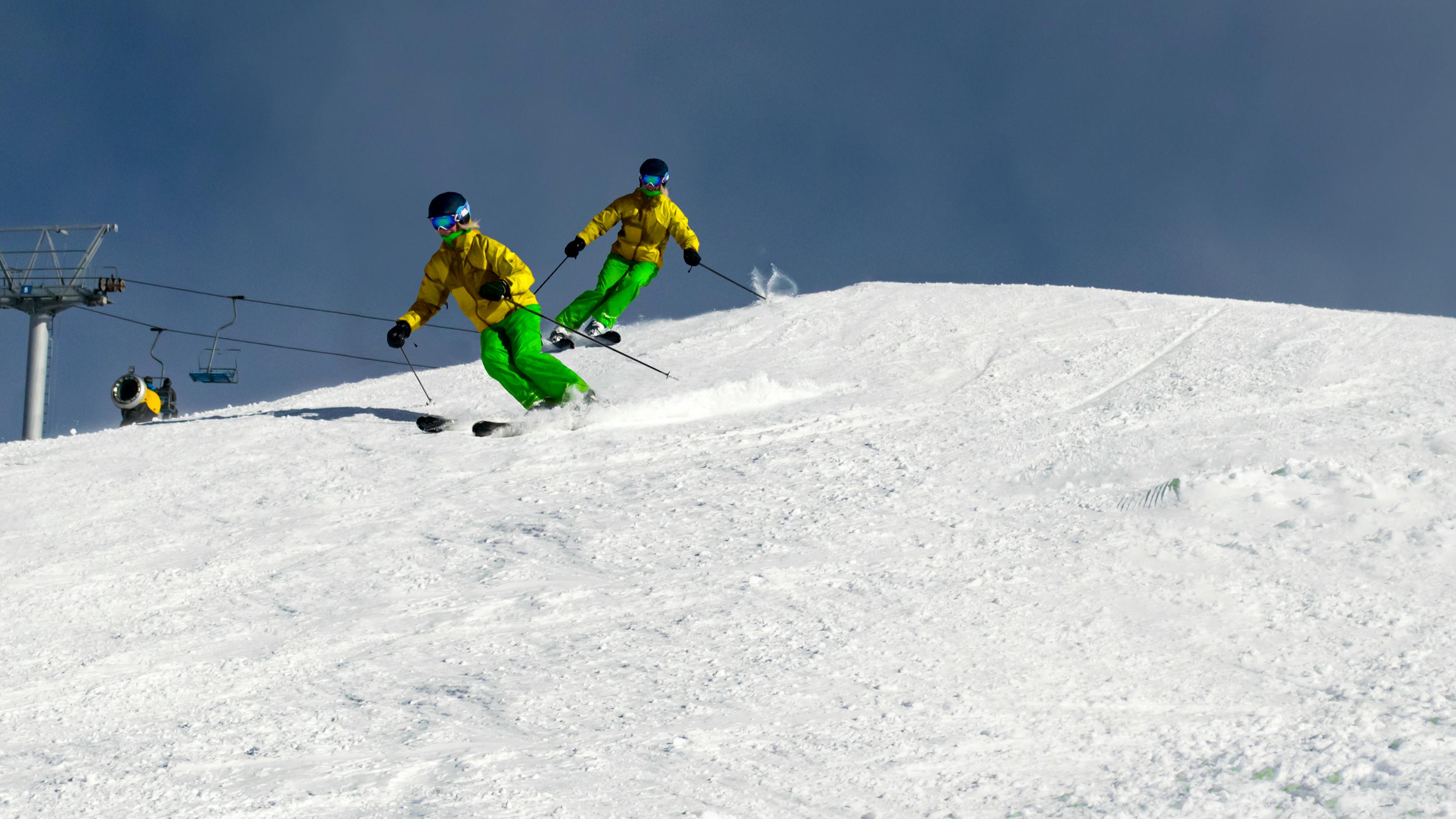 A skier carves down a ski hill. 