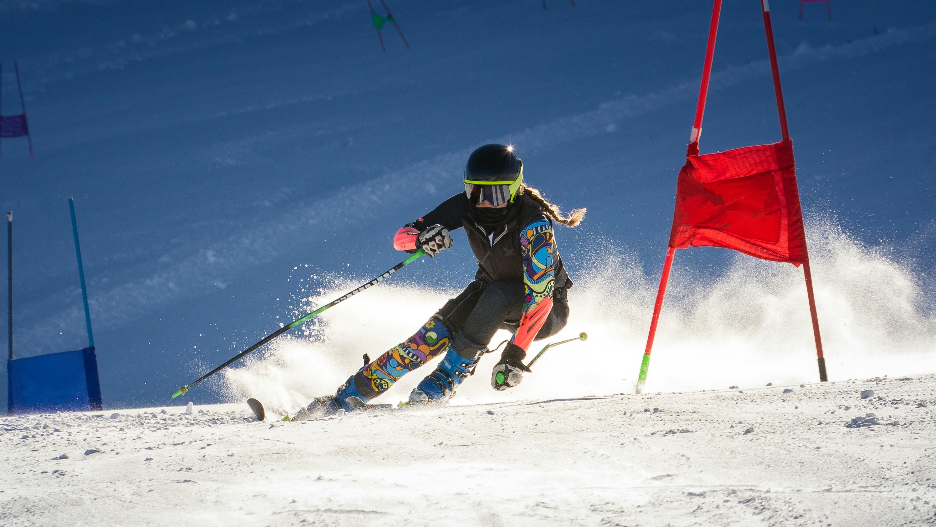A skier racing down a hill. 