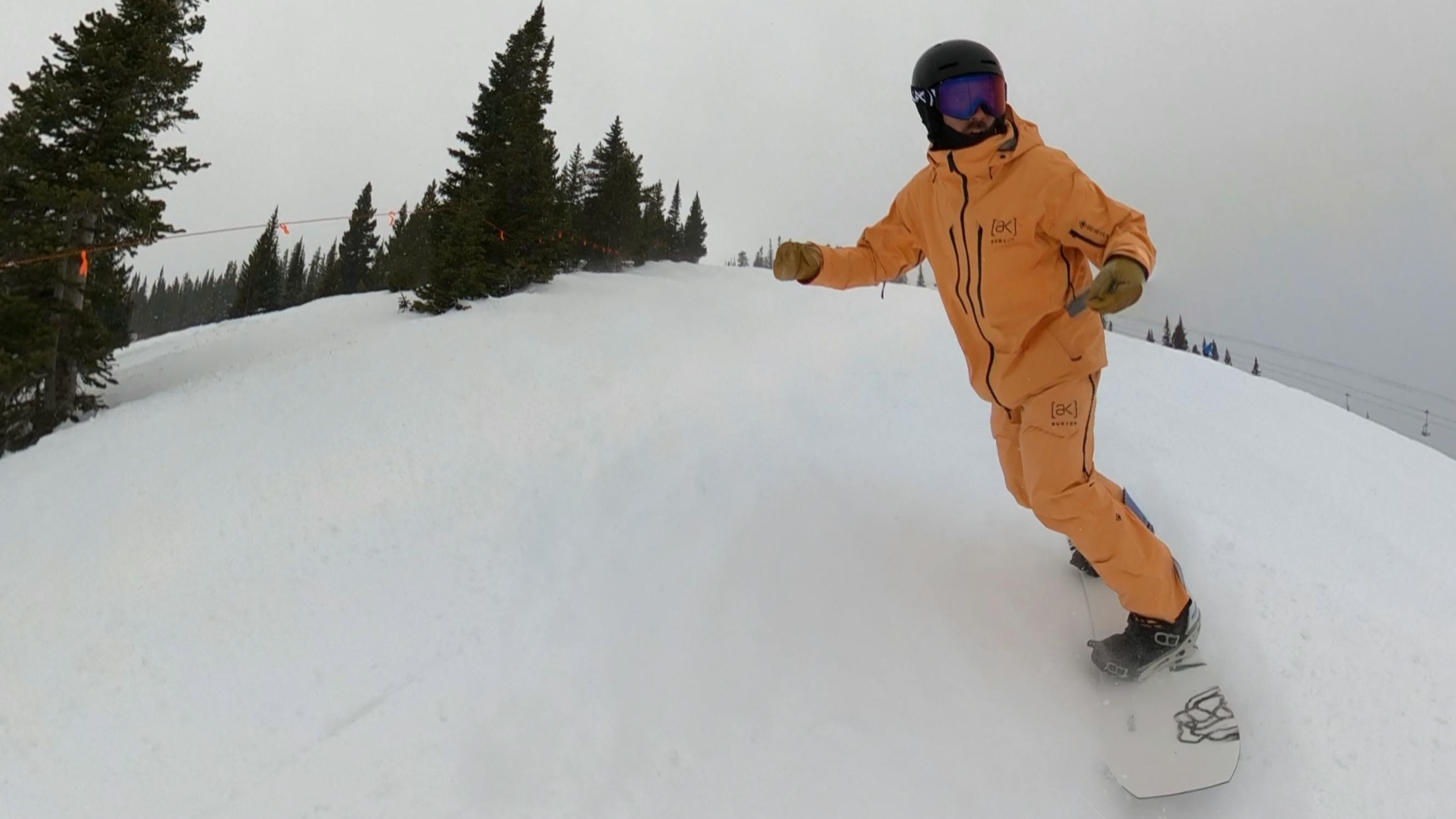 A snowboarder on the  Ride Twinpig Snowboard. 
