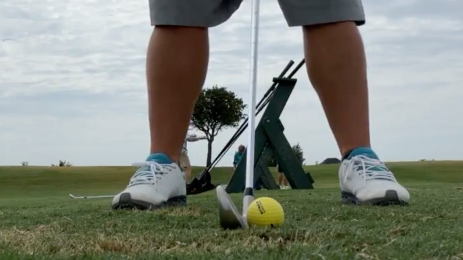 A golfer using the  Cobra Aerojet Irons.